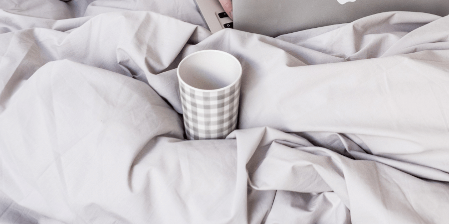 Cup of water in bed