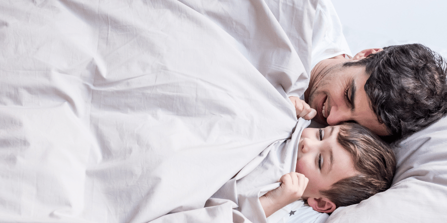 A dad and his kid in Zizzz bedding